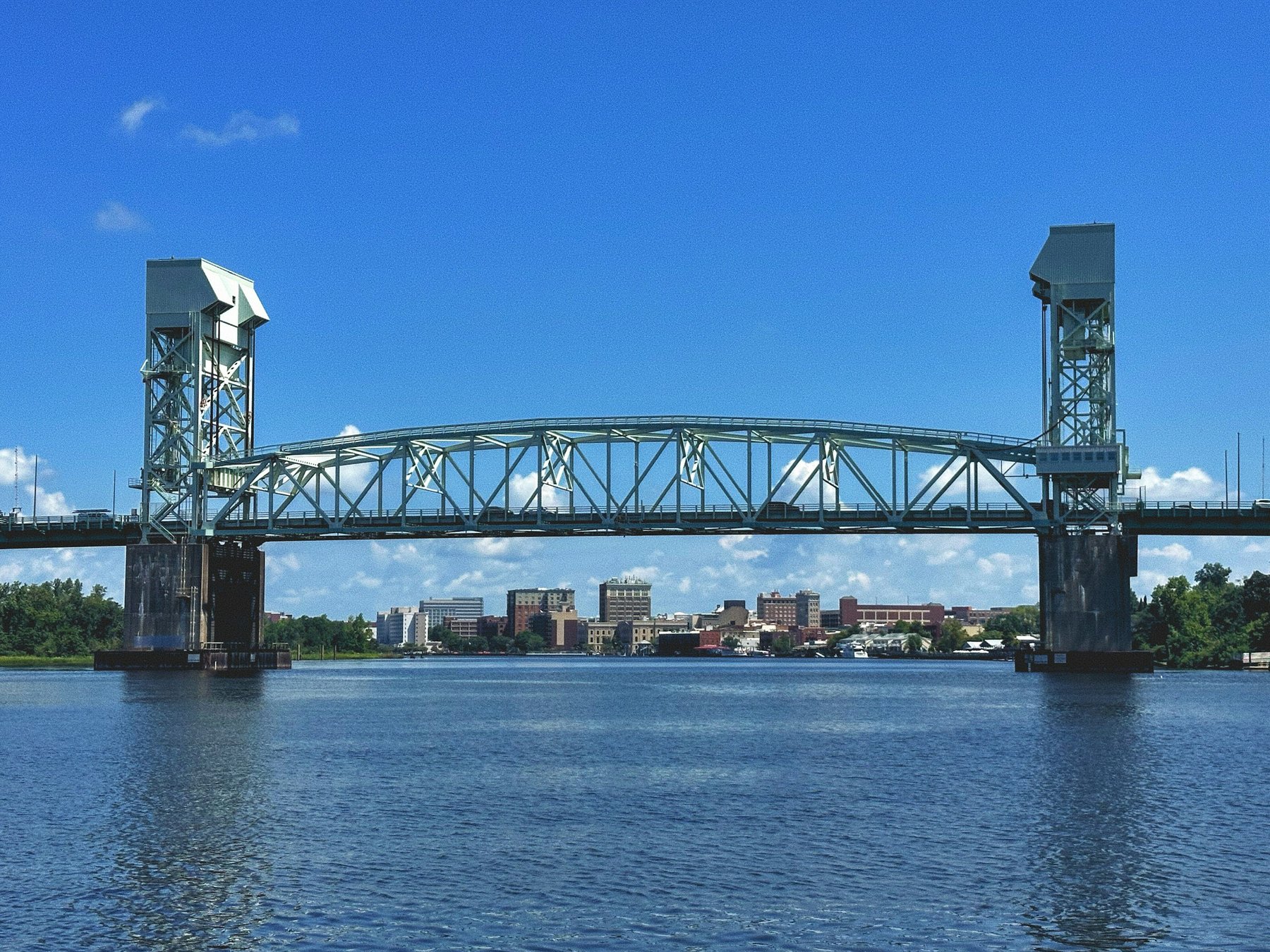 Cape Fear Memorial Bridge over the river with downtown Wilmington behind it